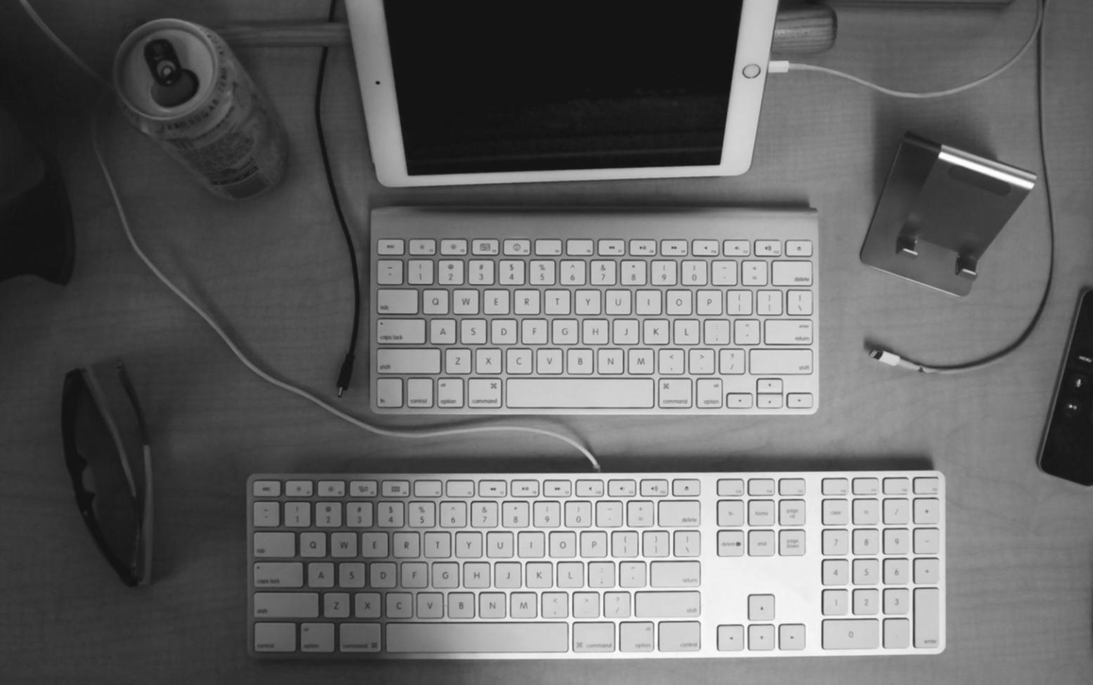 Investment research analyst reviewing financial data and market statistics on computer screens